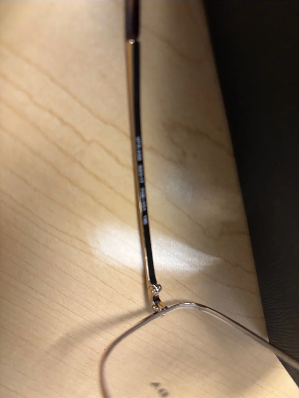 Prada Women's Gold Metal Frame Glasses with Clear Lenses
